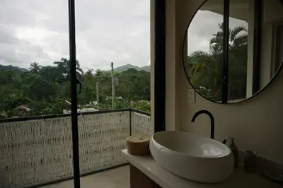 a bathroom with a tub and a window with a view at Yara-ri Apartaments in La Majagua