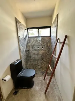 a bathroom with a toilet and a shower at Casa Ola, luxurious jungle house in El Valle