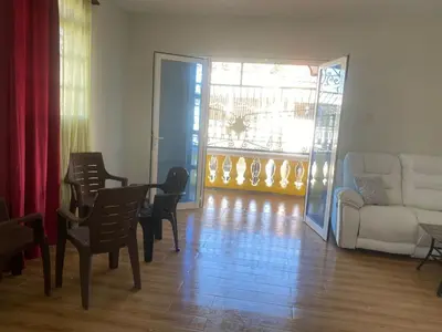 a living room with a couch and a table and chairs at Hotel Mi Propio Esfuerzo in Vicente Noble
