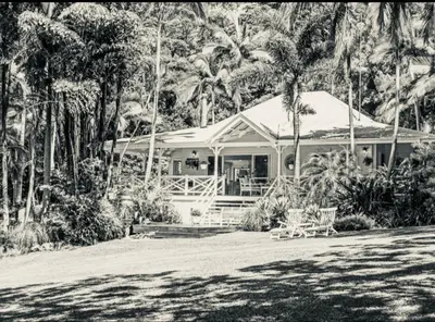 a black and white photo of a house with palm trees at Casa Maona in El Limón