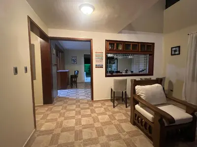 a living room with a couch and a table at Casa en río san Juan 4 habitaciones in Río San Juan