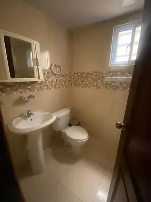 a bathroom with a toilet and a sink at Como apartamento in La Javilla