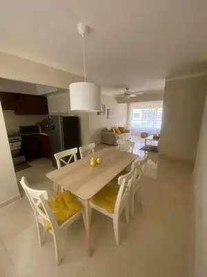 a kitchen and dining room with a table and chairs at Como apartamento in La Javilla