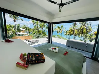 a bedroom with a bed with a view of the ocean at Casa Juan Lucas in Las Galeras
