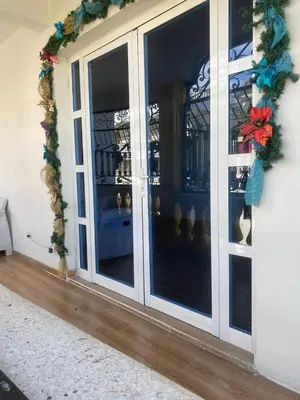 a door with a christmas wreath on a building at My propio esfuerzo in Vicente Noble