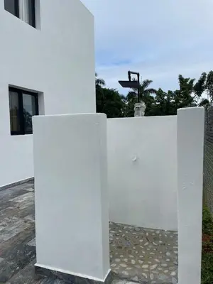 a white wall with a light on top of it at Casa Entre Playas - 14 pax, 3 min de la playa en Las Galeras in Las Galeras