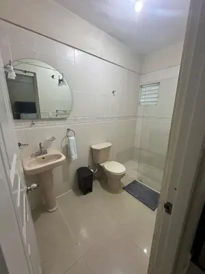 a bathroom with a toilet and a sink and a shower at Casa de la presa in Monción