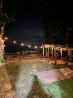 a night view of a deck with a tent at Apartamento con Vista al Mar PalmeritaVillage in El Valle