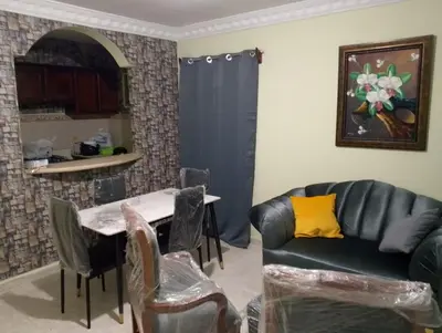a living room with a couch and a table at confor y seguridad in Santo Domingo