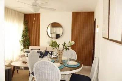 a dining room with a table and chairs at Apartamento Playa Juan dolio in Villas del Mar