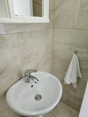a bathroom with a white sink and a mirror at Full Department 2 hab in Las Terrenas