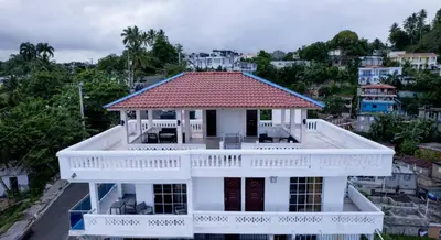 an aerial view of a white house with a red roof at Villas Hillside apt 3 in Santa Bárbara de Samaná