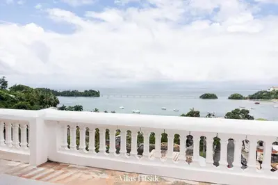 a view of the ocean from the balcony of a resort at Villas Hillside apt 3 in Santa Bárbara de Samaná