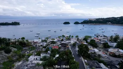 an aerial view of a town with boats in the water at Villas Hillside apt 3 in Santa Bárbara de Samaná