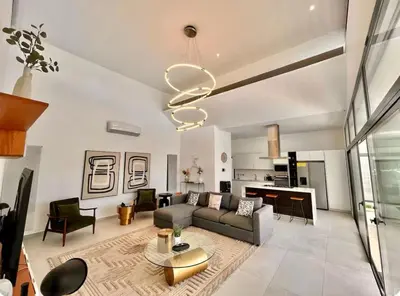 a living room with a couch and a table at 5 Bedroom Villa With Daily Housekeeping in Las Terrenas