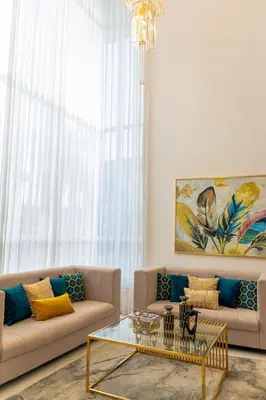 a living room with two couches and a glass table at Modern and luxurious house in Santiago in Santiago de los Caballeros