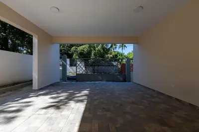 an empty room with a large window and a fence at Luxurious Home with Pool in San Felipe de Puerto Plata