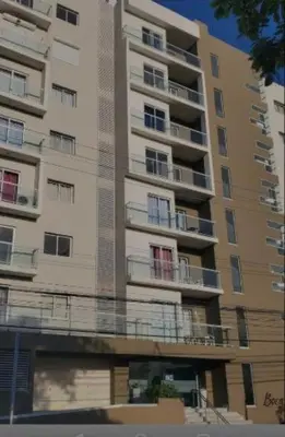 a tall building with balconies on the side of it at Vista al mar in Boca Chica