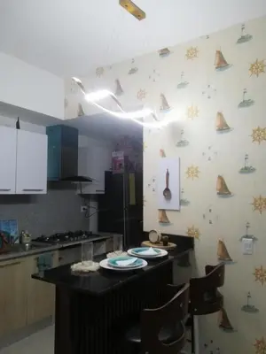 a kitchen with a table with plates on it at Vista al mar in Boca Chica