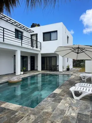 a villa with a swimming pool and a house at Apartamento Entre Playas 1 - 3 pax, 4 min de la playa in Las Galeras
