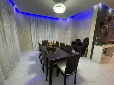 a dining room with a black table and chairs at Villa VP One - Punta rucia beach in Punta Rucia