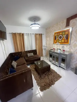 a living room with a couch and a table at Antare ll edificio 52 A3 in Santo Domingo