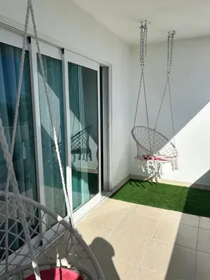 an empty balcony with a swing on a building at Gran Apartamento frente al mar in La Francia