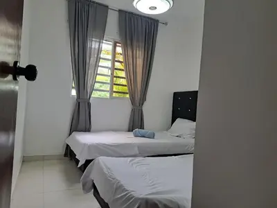 two beds in a room with a window at Ciudad Juan Bosch StoDgo este in La Javilla