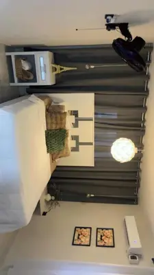 a room with a bed and a wall with pictures at Heaven apart cerca del aeropuerto parqueo incluído TAXI DISPONIBLE in Monte Adentro
