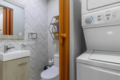 a small bathroom with a toilet and a sink at Charming space in the city center in Santo Domingo