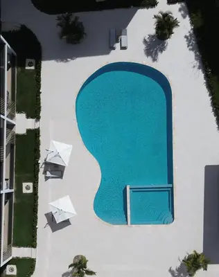 an overhead view of a swimming pool in a building at Amazing pool views apartment in Playa Bavaro in Punta Cana