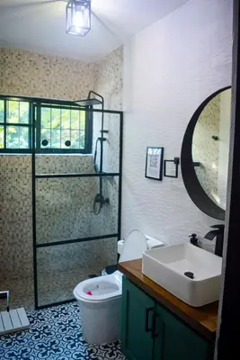 a bathroom with a sink and a toilet and a shower at Villa moderna 95 in San José de Las Matas