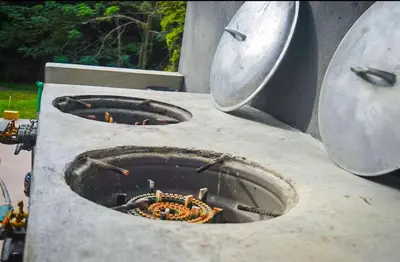 a stone oven with a fire inside of it at Villa moderna 95 in San José de Las Matas