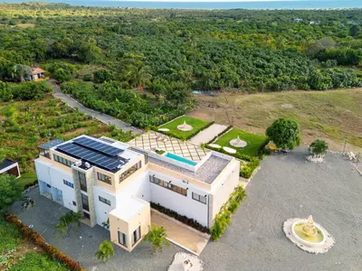 an aerial view of a house with solar panels on it at Villa La Chiquita Paradise Pool and BBQ in Baní