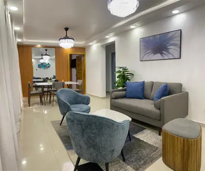 a living room with a couch and chairs and a table at Modern, Unique And Stylish 1 Bedroom Apartment in San Pedro de Macorís