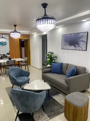 a living room with a couch and chairs and tables at Modern, Unique And Stylish 1 Bedroom Apartment in San Pedro de Macorís