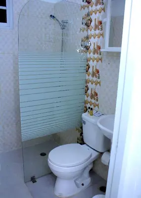 a bathroom with a toilet and a sink at RGgrup in Pantoja