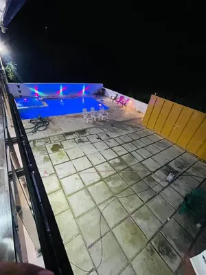 a swimming pool under construction at night at Villa Estela Jarabacoa in Jarabacoa