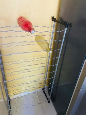 a kite is on the wall of a shower at Rincón del Mojito in Santa Cruz de Barahona