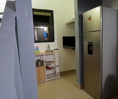 a kitchen with a stainless steel refrigerator in a room at Casa Ballenas2 in Las Terrenas