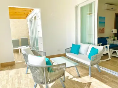 a living room with chairs and a couch at Escape-Fortunity 1 in San Felipe de Puerto Plata