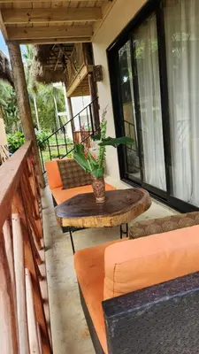 a group of tables and chairs on a patio at Boho villas and spa in El Valle