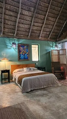 a bedroom with a large bed in a room at Boho villas and spa in El Valle