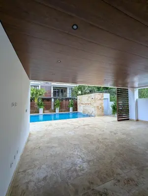 an empty patio with a swimming pool in a house at Marbella in San Felipe de Puerto Plata