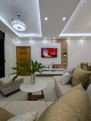 a living room with a couch and a table at Marbella in San Felipe de Puerto Plata