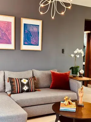 a living room with a couch and a table at Acogedor Penthouse de 2 habitación in Santiago de los Caballeros
