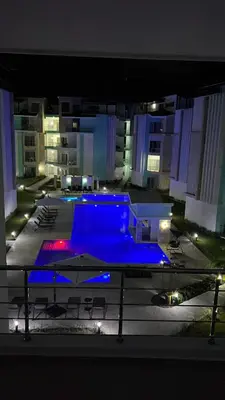 a swimming pool in the middle of a building at night at Punta cana in El Seis