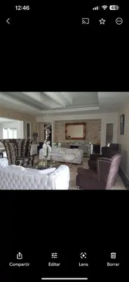 a picture of a living room with a couch and chairs at Punta cana in El Seis