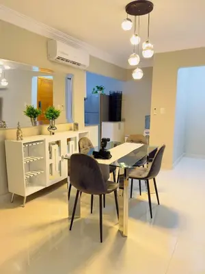 a kitchen with a dining room table and chairs at Excelente Apartamento Completo Renta Carro Disponible in La Viva