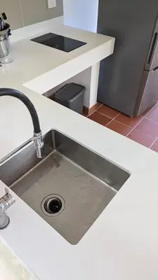 a kitchen counter with a sink in a kitchen at Spacious Apartment w Pool in Las Terrenas